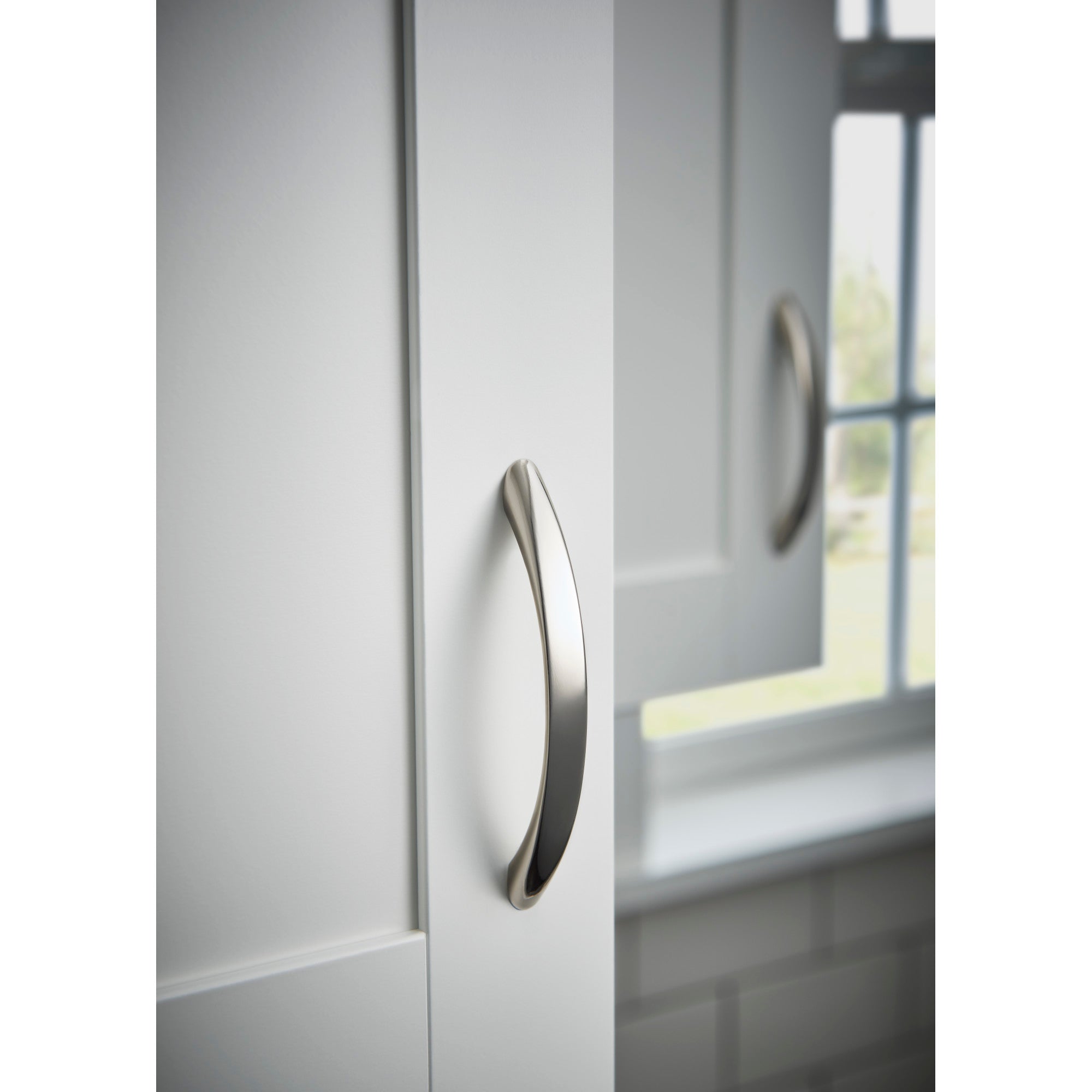 Worldwide Flooring Design Center Nouveau Bow Pull 3 3/4 Inch (c-c) Polished Nickel Nouveau Bow Pull 3 3/4 Inch (c-c) Polished Nickel Top Knobs Decorative Hardware